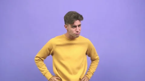 Young caucasian student man looking forward, scolding someone very angry Stock-Footage 138700636