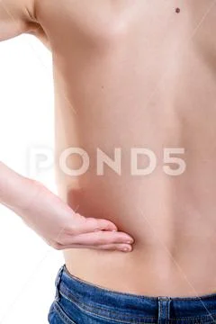 Young caucasian teenage boy who has hurt his back Stock Photos