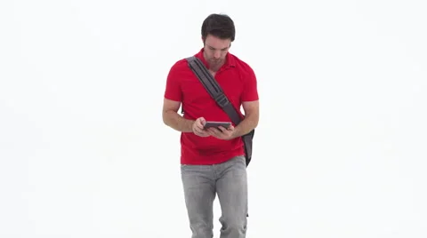 Young caucasian using tablet and walking Stock Footage 67355487