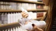 Young Caucasian Woman Buying Ethical Body Care Cream Products In Supermarket. 4K Stock Footage