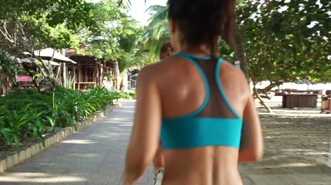 Young caucasian women are running and overtaking each other while jogging on the Stock Footage