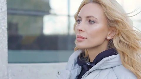 Young charming smiling lady in coat Video stock 99145892