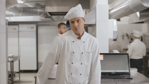 Young cheerful chef singing with kitchen utensil at work Stock Footage 125050406