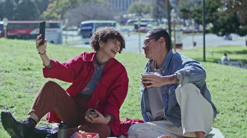 Young Cheerful Couple Taking Selfie and Drinking Yerba Mate Tea at Park Picnic Stock Footage 345386660