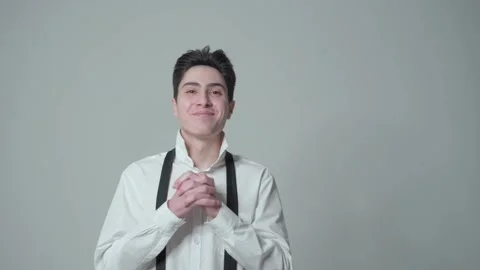 A young cheerful guy expresses a sense of joy and contentment. Get good news. Stock Footage 148436166