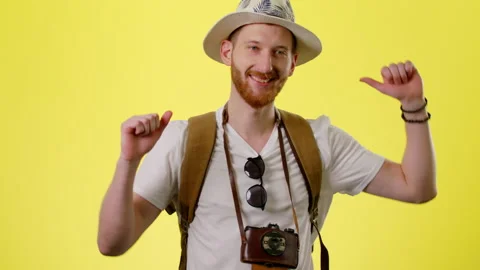 Young Cheerful Man With Backpack, Hat And Camera Happy Tourist Dancing Stock Footage 170187545