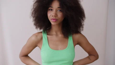 Young cheerful woman posing in studio. Stock Footage 231994882