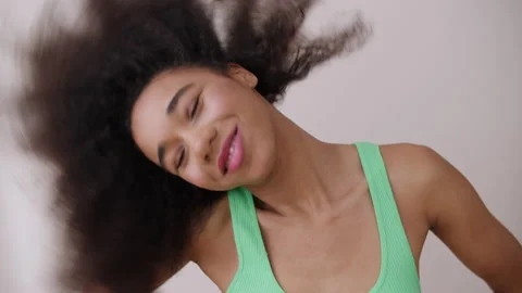 Young cheerful woman posing in studio. Stock Footage 231995223