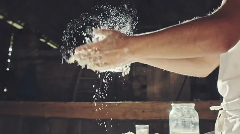 Young chef clapping his hands filled with flour Video stock 67732085