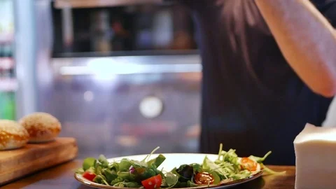 Young chef prepares salad for steak Stock-Footage 78730889