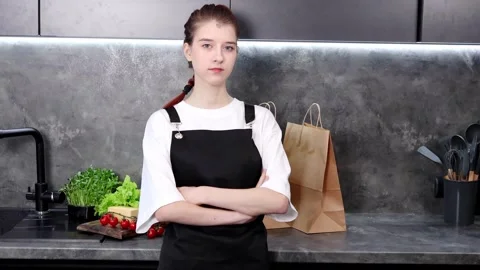 Young chef preparing a fresh meal in a stylish kitchen Stock-Footage 296317044