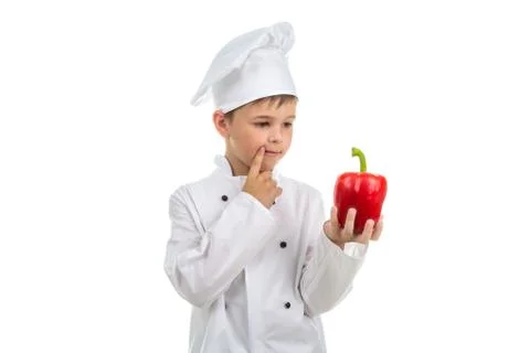Young chef thinking about creative salad idea to make - isolated on white Stock Photos