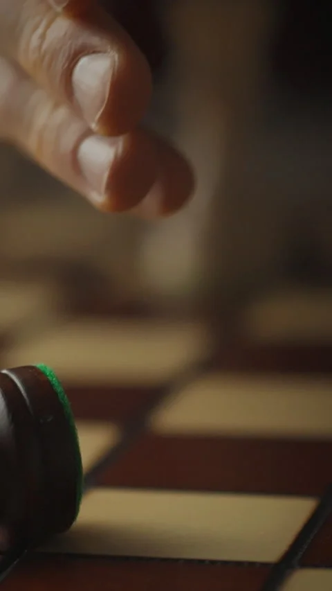 Young chess player triumphs as veteran king concedes defeat in intense match Stock Footage 331740242