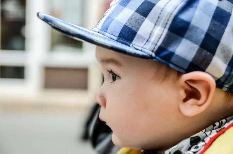 Young child with basecap looking with big eyes Stock Photos