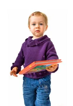 Young child with a book Stock Photos