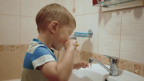 Young child brushing his teeth Stock Footage 76607634