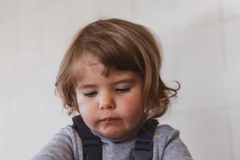 Young child developing cognitive skills through a fun puzzle game Stock Photos