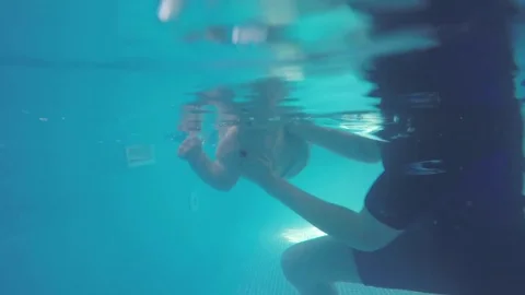 A young child dived into the pool.  Stock Footage 82558302