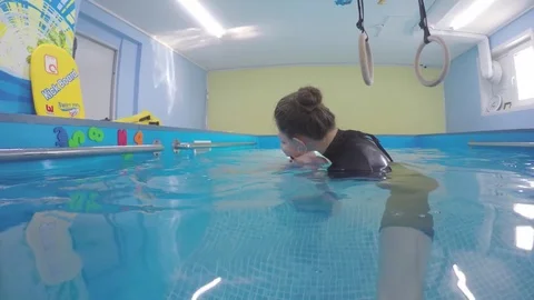 A young child dived into the pool.  Stock Footage 82558379