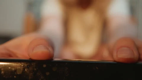 Young child eagerly interacts with oven during family baking session. Curious Stock Footage 337460399