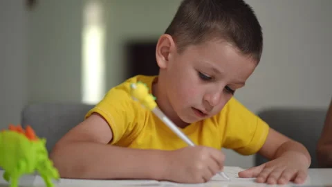 A Young Child Engaged in a Fun and Creative Drawing Activity Happily at Home  Stock Footage 305268799