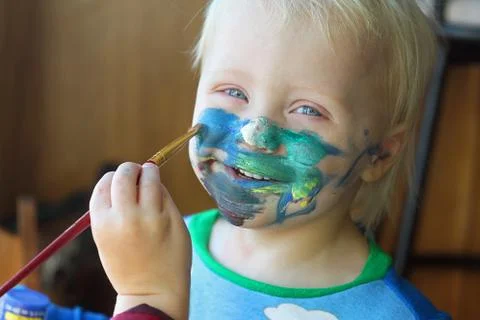 Young child getting his face painted Stock Photos