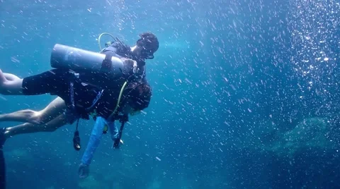 Young child learning to scuba dive Stock Footage 58296861