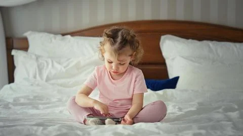 Young child learning using portable digital device Stock Photos