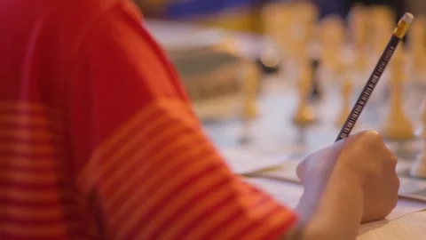 Young child playing chess in chess tournament. Stock Footage 252628889