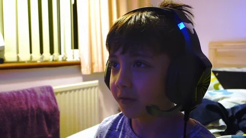 A young child playing a computer game Stock Footage 105430589