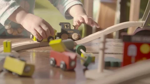 Young child playing with train set in slow motion Stock Footage 68926442
