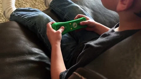 Young child playing video game HD Video stock 73709999