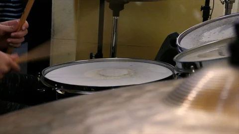 Young child plays drums on drumset Stock Footage 120560529