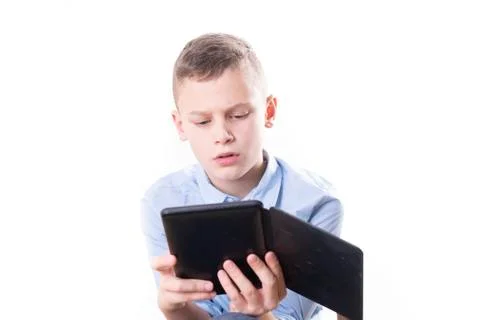 Young child reading strained in an e book reader on white background Stock Photos