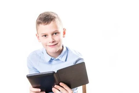 Young child reading strained in an e book reader on white background Stock Photos