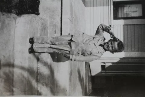 Young child saluting Foto stock