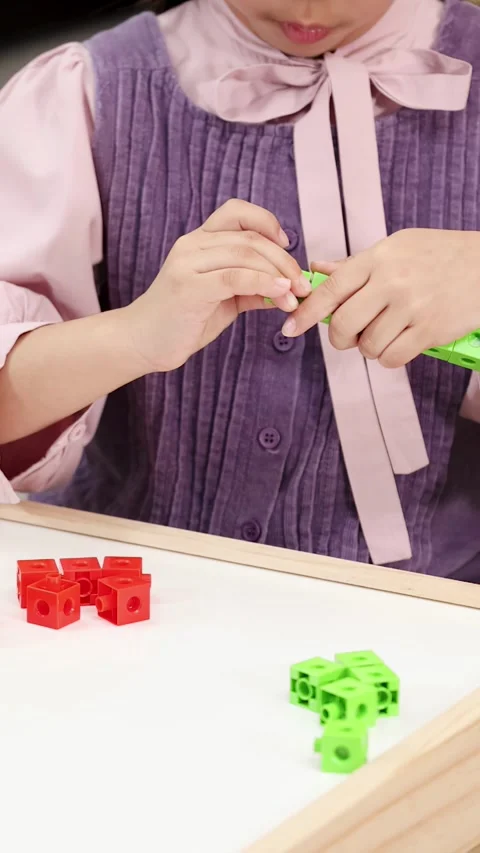 Young Child Sorting and Connecting Colorful Math Manipulative Stock Footage 327197445