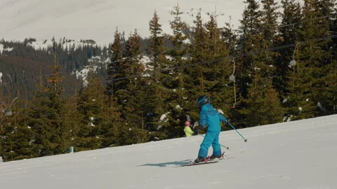 Young child struggling while learning to ski on trackhill. Stock Footage 295888152