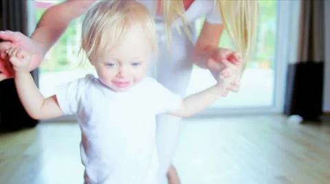 Young Child Taking First Steps Stock Footage