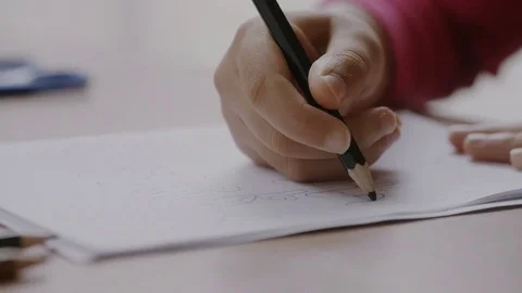 Young child using color pencil in her co... | Stock Video | Pond5
