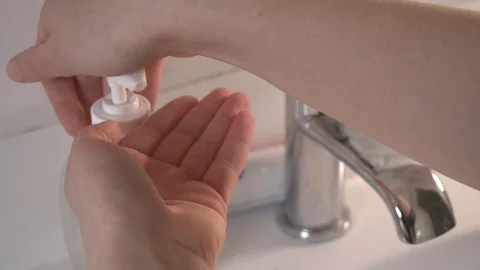 Young child using a soap dispenser in slow motion Stock Footage 126801788