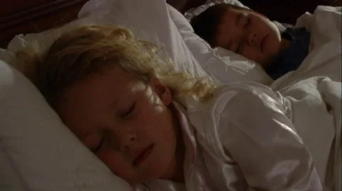 Young Children asleep in bed Stock Footage 43697998