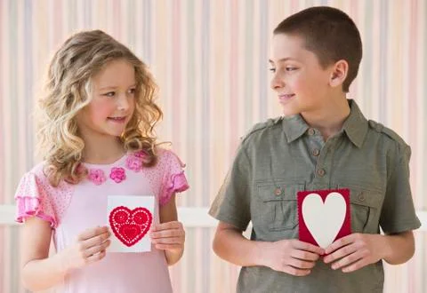 Young children holding Valentine cards Stock Photos