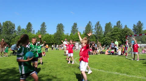 Young children playing handball Stock Footage 24575080