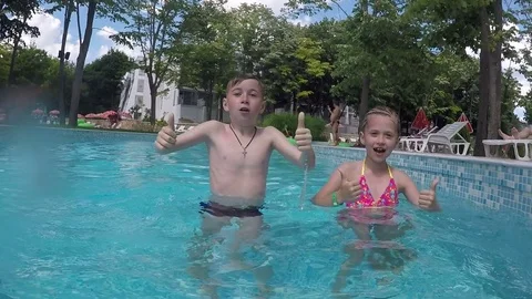 Young children in the pool Stock Footage 70557309