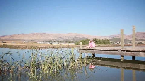 Young Children Sitting on Dock HD  Stock-Footage 68063246