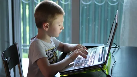 Young children using computer to do homework 動画素材 134896748