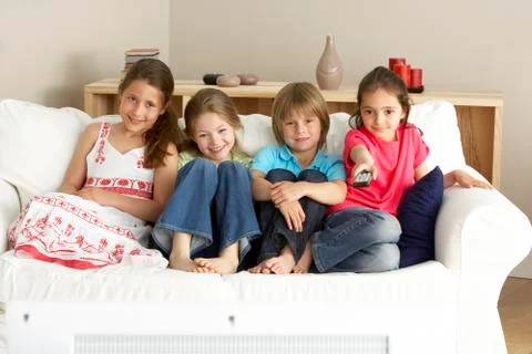 Young Children Watching Television at Home Stock Photos