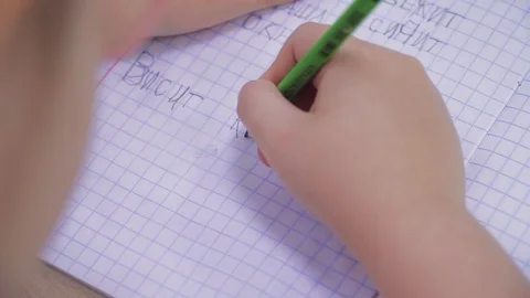 Young children write Russian words in notebooks Stock Footage 111813847