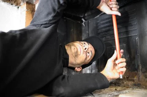 Young chimney sweep at work Stock Photos